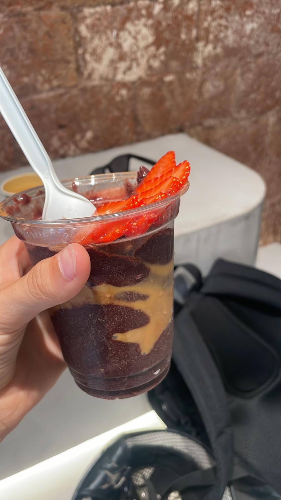 Tropical Mango Sunrise açaí bowl with coconut flakes and pineapple